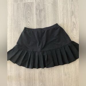 Pre-owned tennis skort in XS by Fila. Upper thigh length.